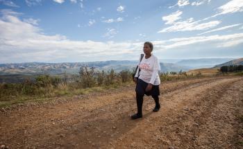 A community health agent on her way to deliver HIV counseling and testing services