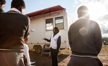 Learners of Hhashi High School in the remote Umlalazi Municipality under Uthungulu Districtict in KwaZulu-Natal stand in line to receive HIV Counselling and Testing at Doctors Without Borders (MSF) Mobile 1-Stop Shop