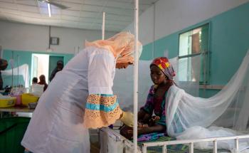 MSF treating patient with Malaria