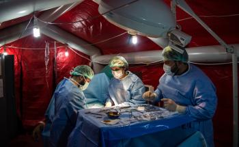 MSF staff in an operation to extract a bullet from patient in Northern Syria