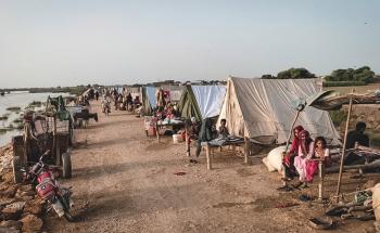 Flood-affected people taking shelter in tents