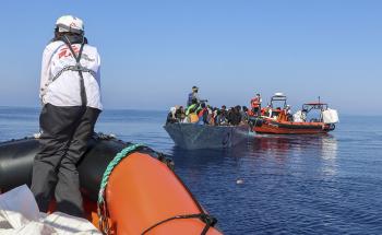 MSF teams operate the first rescue of the day from a boat in distress with xx people on board.