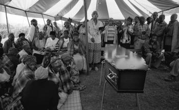 Family and friends at the funeral of an AIDS patient.