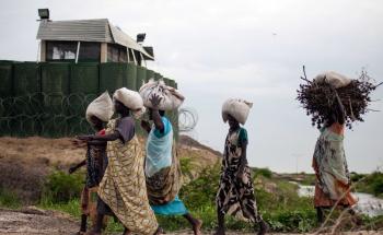 Women carrying charcoal and firewood 