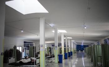 The aisles of the hospital specialising in COVID-19 in Hassakeh, in northeastern Syria, is lit by light filtering from the windows. This hospital opened in 2020. What was a chicken coop has been transformed into an emergency hospital to treat people with COVID-19. 