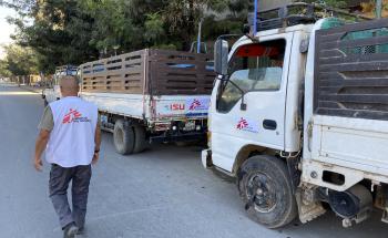 A picture of an MSF worker supervising trucks being loaded with supplies in Mekele to be sent to other parts of the Tigray region in northern Ethiopia. 