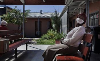 A woman and her son outside a waiting room in Mayenzeke tuberculosis clinic in Khayelitsha