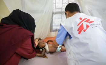 MSF, Doctors without borders, Dr Aref checking on  1 and a half year old