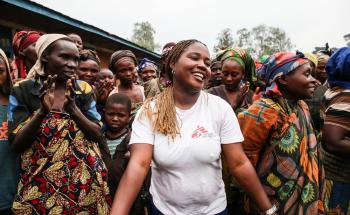 Sifa Banzira Clementine, MSF mental health supervisor, during a theatre and dance performance outside of Mweso school in North Kivu, DRC