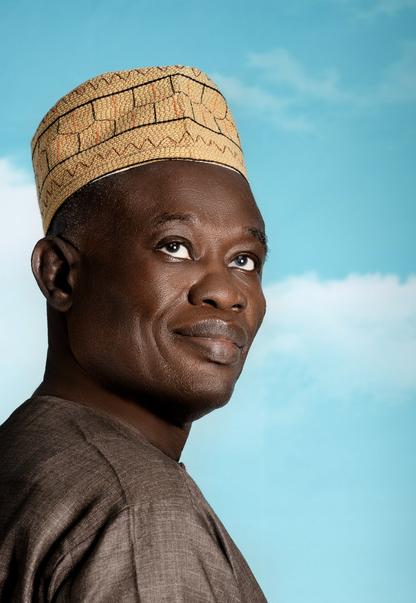 Hassimiou Camara, an MSF peer educator who is living with HIV, looks up to the sky.