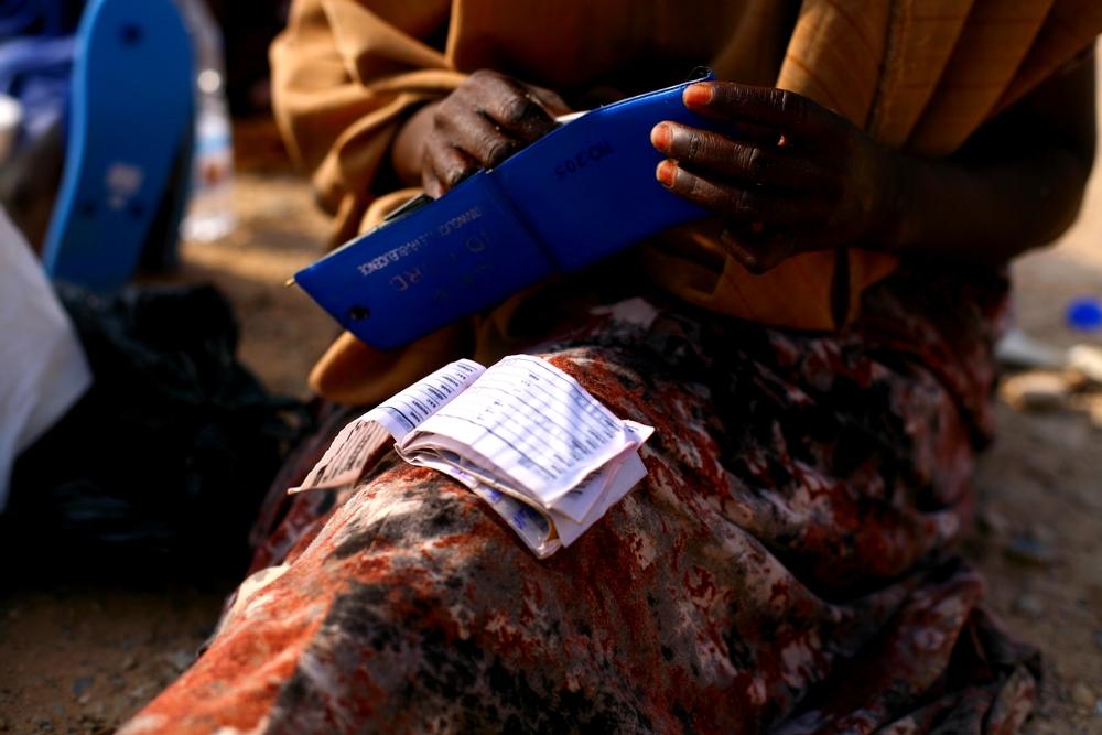 A woman drying her papers in southern Yemen