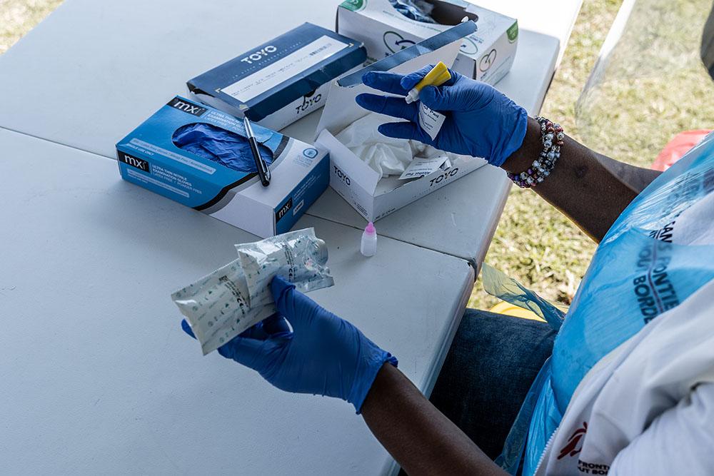 A fieldworker prepares HIV test kit which forms part of MSF's response to the COVID-19 pandemic. Vulnerable populations can be screened for COVID-19 and other diseases like HIV and Diabetes. 