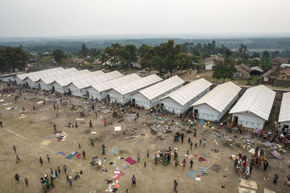 This aerial photograph shows the informal site of conflict-displaced people settled in the Rutshuru Centre stadium, in North Kivu province, eastern Democratic Republic of Congo.