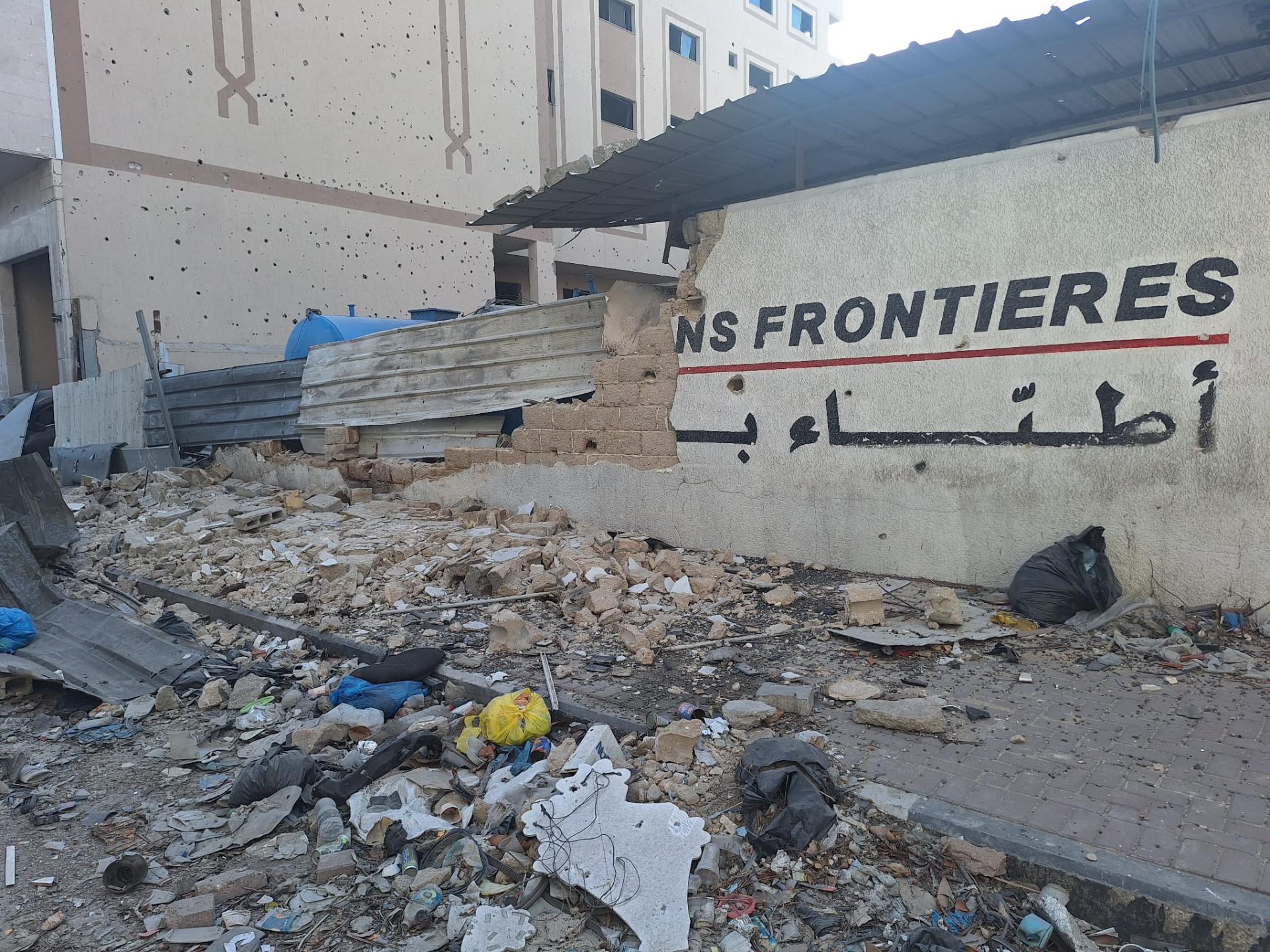 Image of a damaged wall in the MSF office in Gaza due to Israeli bombings.