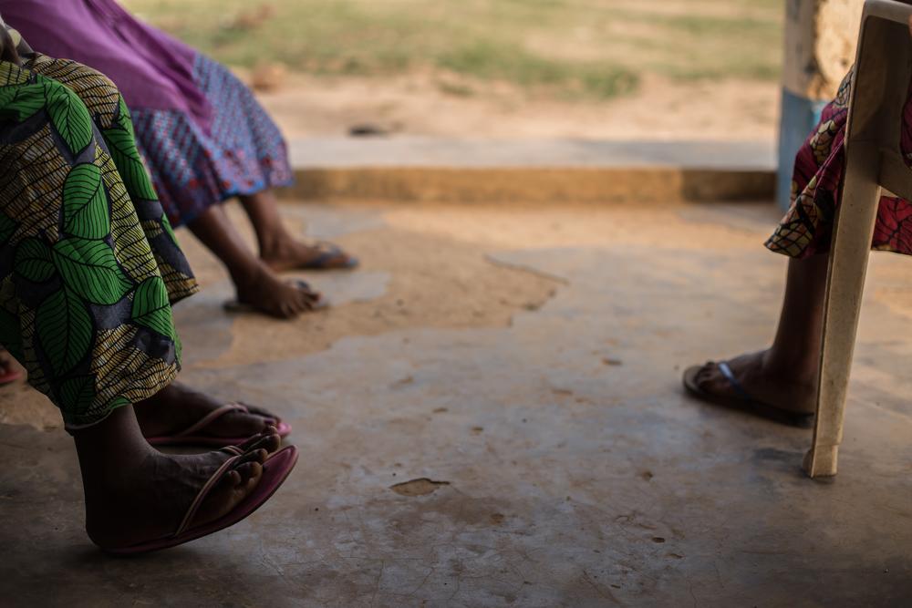 The feet of victims of sexual and gender-based violence are seen as they wait for their interviews.