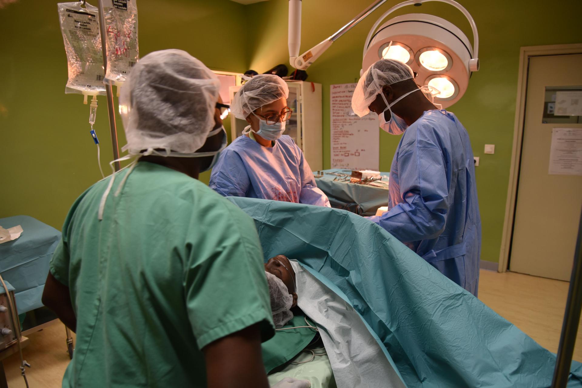 Surgery team performing a caesarean section to deliver a patients' baby. Côte d'Ivoire, March 2017.
