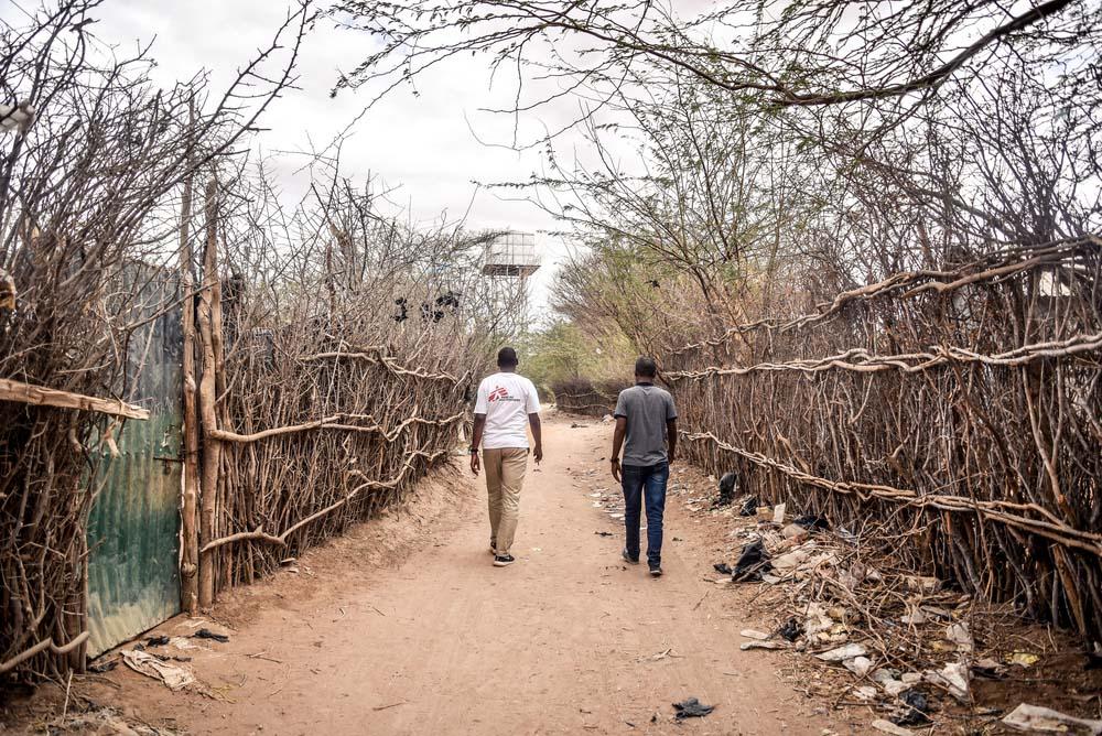 MSF Staff walking through one of the streets in Dagahaley camp, Dadaab