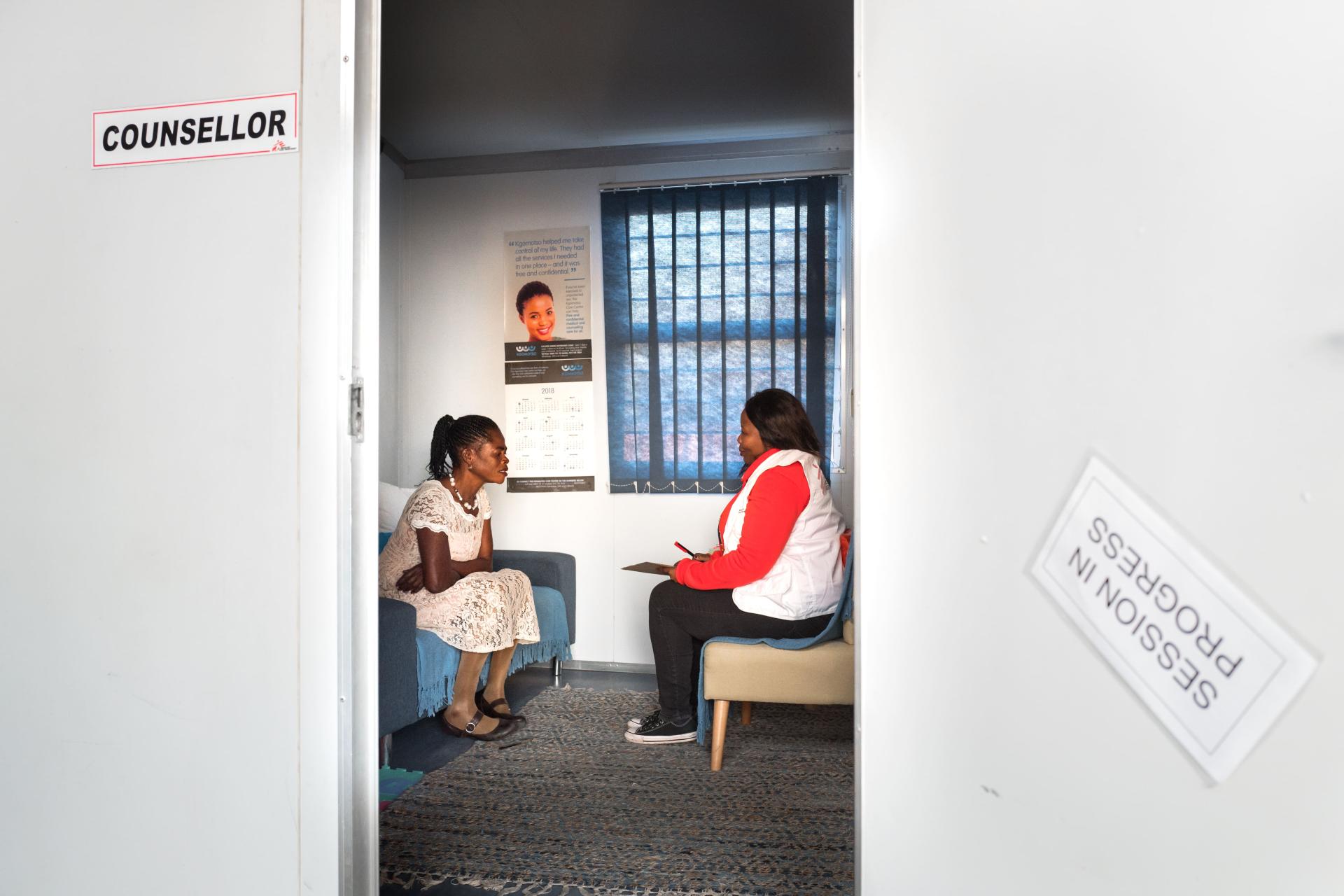 An MSF social worker talks with Rosina Seela Moole, survivor of sexual violence at te BKCC MSF clinic in Rustenburg.