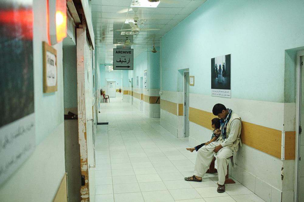 A young patient waiting to be X-rayed with her father at the Kunduz Trauma Centre