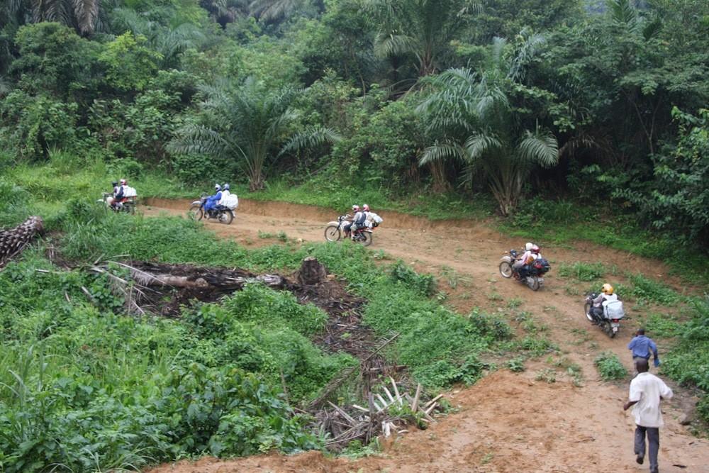 MSF staff travelling to provide mobile clinics via motorbike