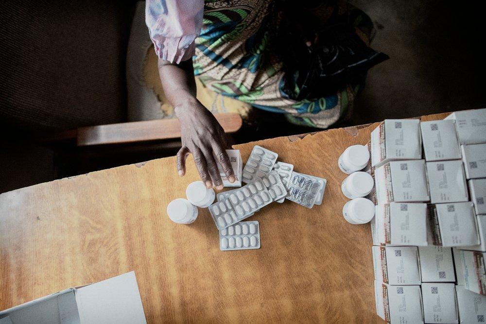 A patient collecting her ARV medication for HIV treatment