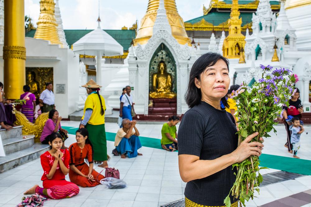 MSF nursing team supervisor praying at the Shwe Dagon Pagoda