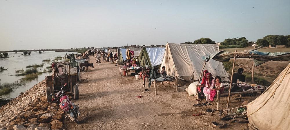 Flood-affected people taking shelter in tents