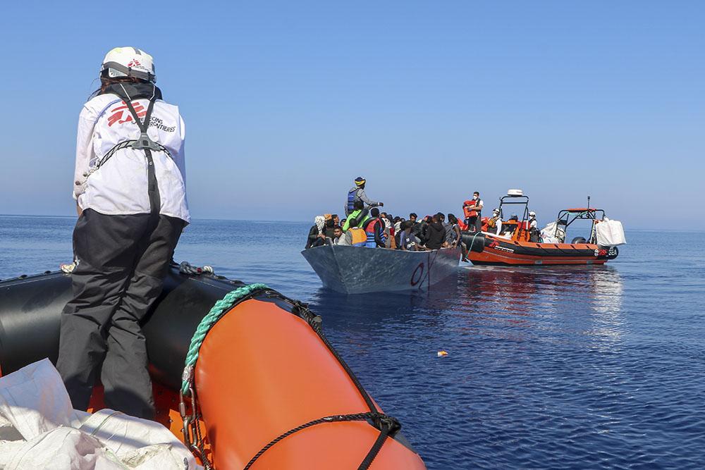 MSF teams operate the first rescue of the day from a boat in distress with people on board 