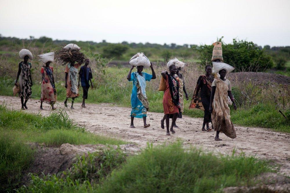 Women carrying charcoal and firewood 