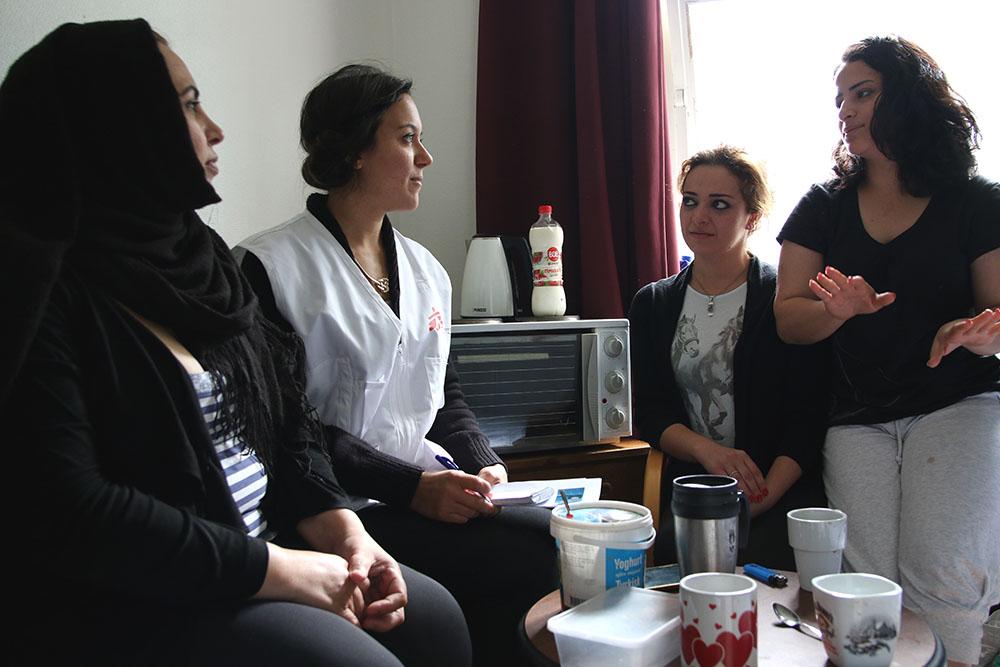 Cultural mediator Sanna Basyouny is explaing MSF mental health activities to three women from Syria and Iraq living in Lundsbrunn asylum centre in Götene, Sweden. 