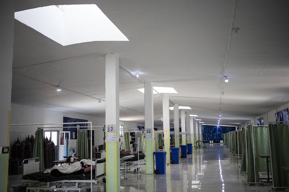 The aisles of the hospital specialising in COVID-19 in Hassakeh, in northeastern Syria, is lit by light filtering from the windows. This hospital opened in 2020. What was a chicken coop has been transformed into an emergency hospital to treat people with COVID-19. 