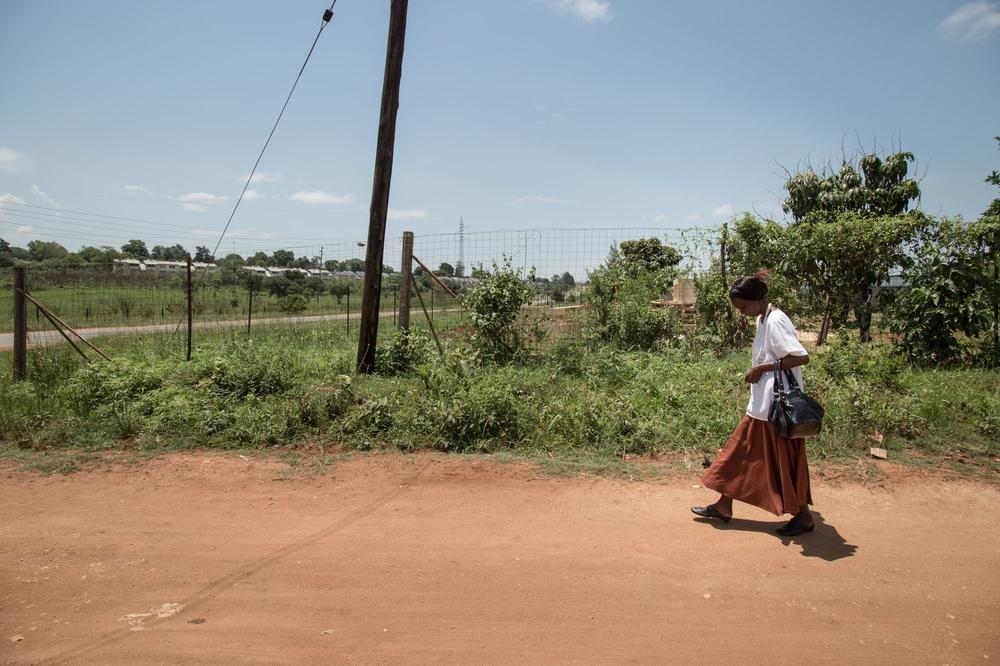 Winile Mabusa, 39, XDR-TB patient & HIV-positive, joins a friend of her to go and get their sign language qualification at the MSF Matsapha clinic. 