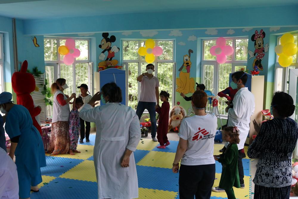 MSF staff with children in Tajikistan