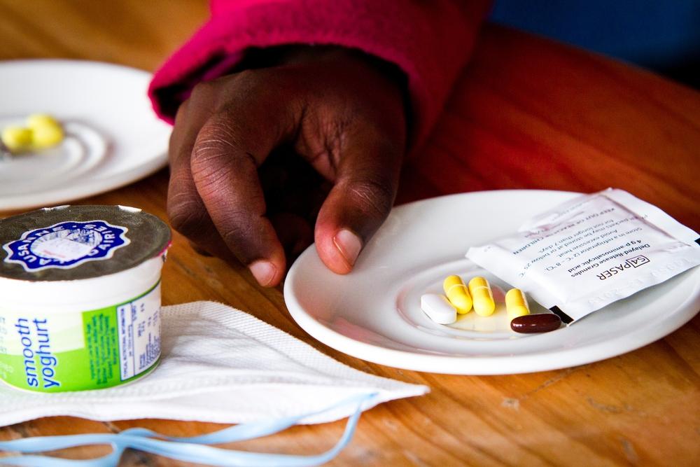 XDR-TB patient takes her tablets at Lizo Nobanda TB Care Centre in Khayelitsha