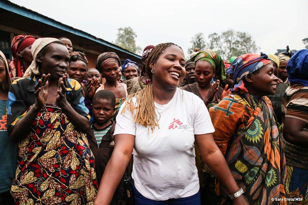 Sifa Banzira Clementine, MSF mental health supervisor, during a theatre and dance performance outside of Mweso school in North Kivu, DRC