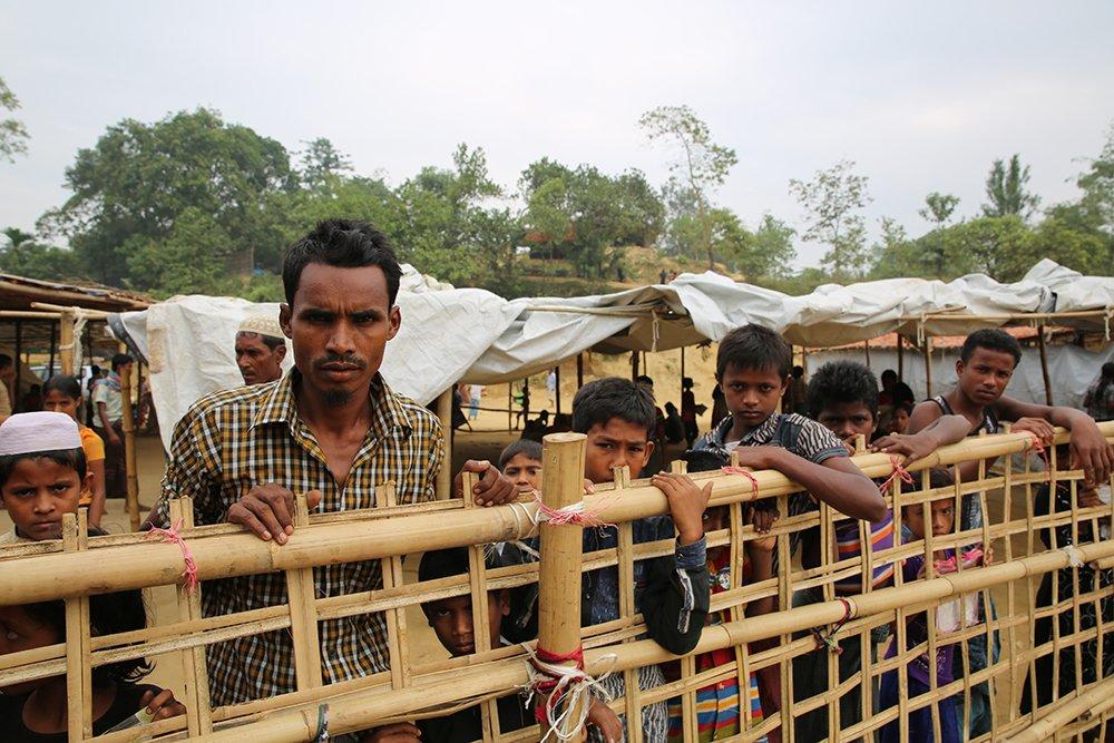 Rohingya refugees in Bangladesh waiting for food at a distribution point.