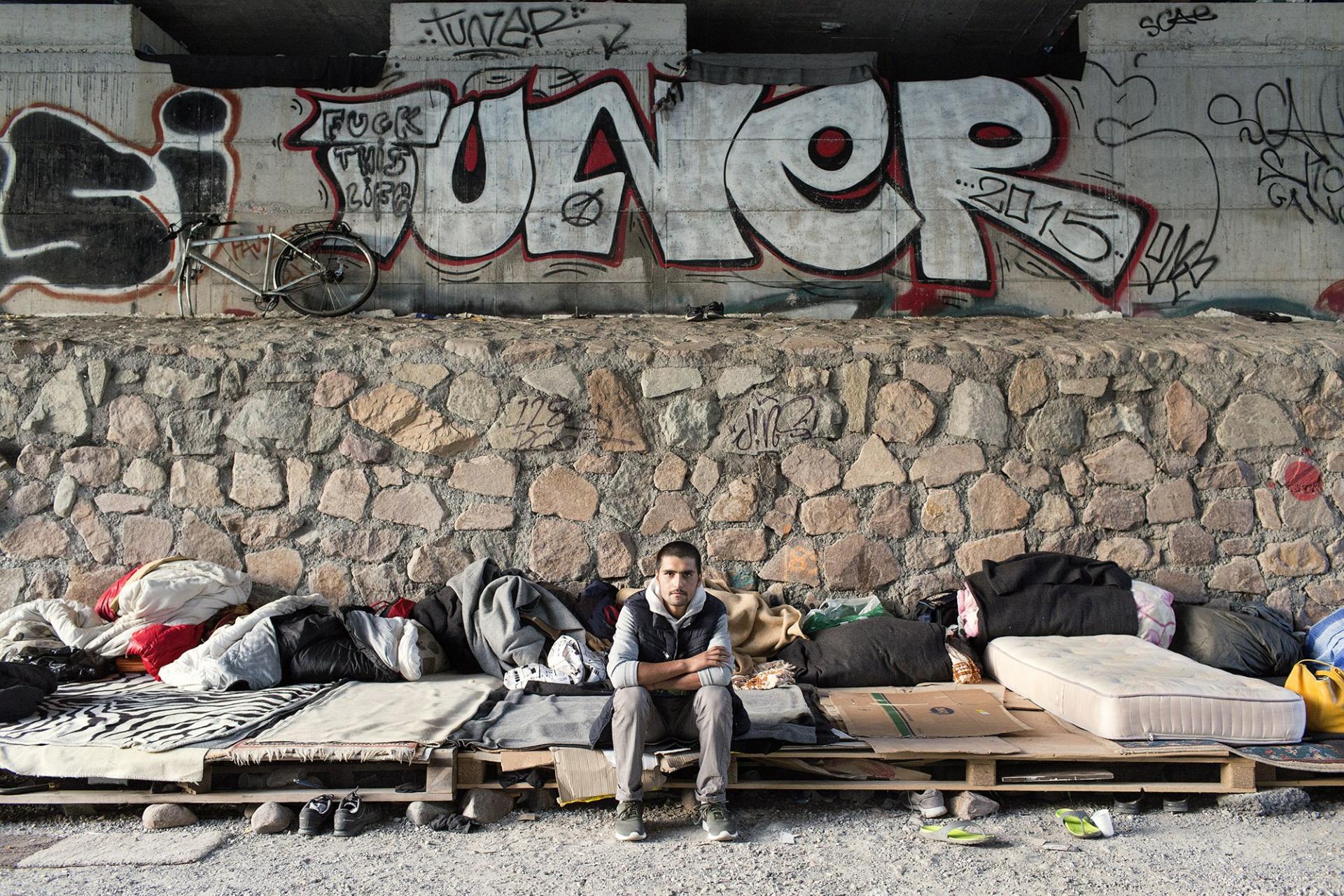 Migrants living under a bridge by the river in Bolzano, Italy 2017