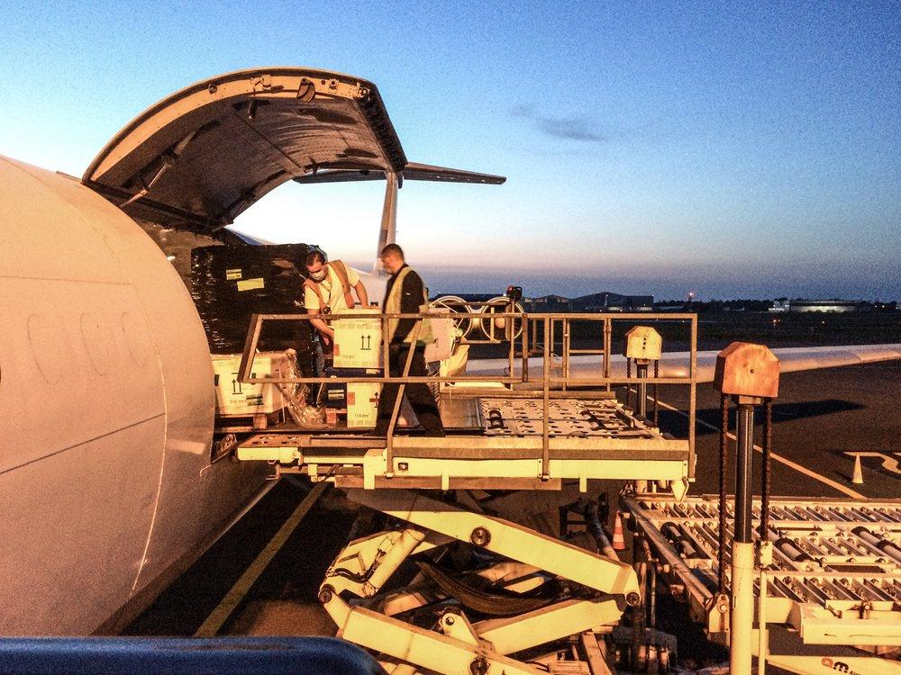 An MSF team loads medical equipment, including an inflatable hospital, onto a plane bound for Isfahan, Iran, to provide support to the coronavirus pandemic in the country.