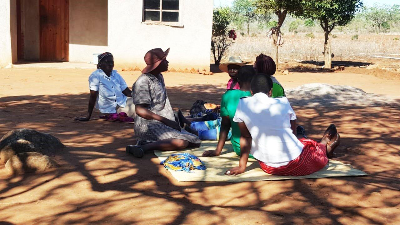 Silethiwe-A Village worker in Zimbabwe using a bicycle to assist her community with HIV/AIDS medicines