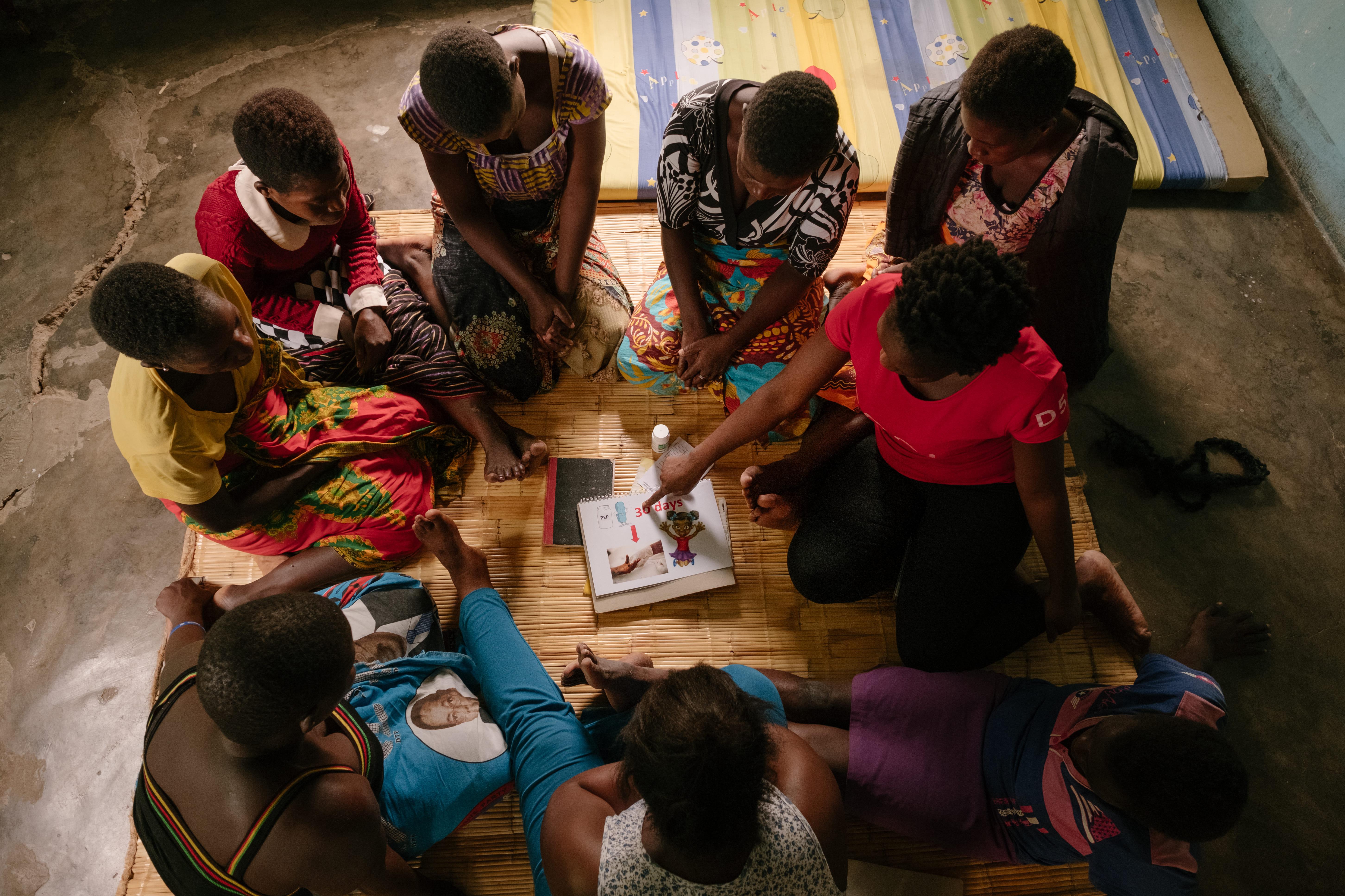 An MSF community health worker Adeline* conducting a health promotion session with a sex worker community