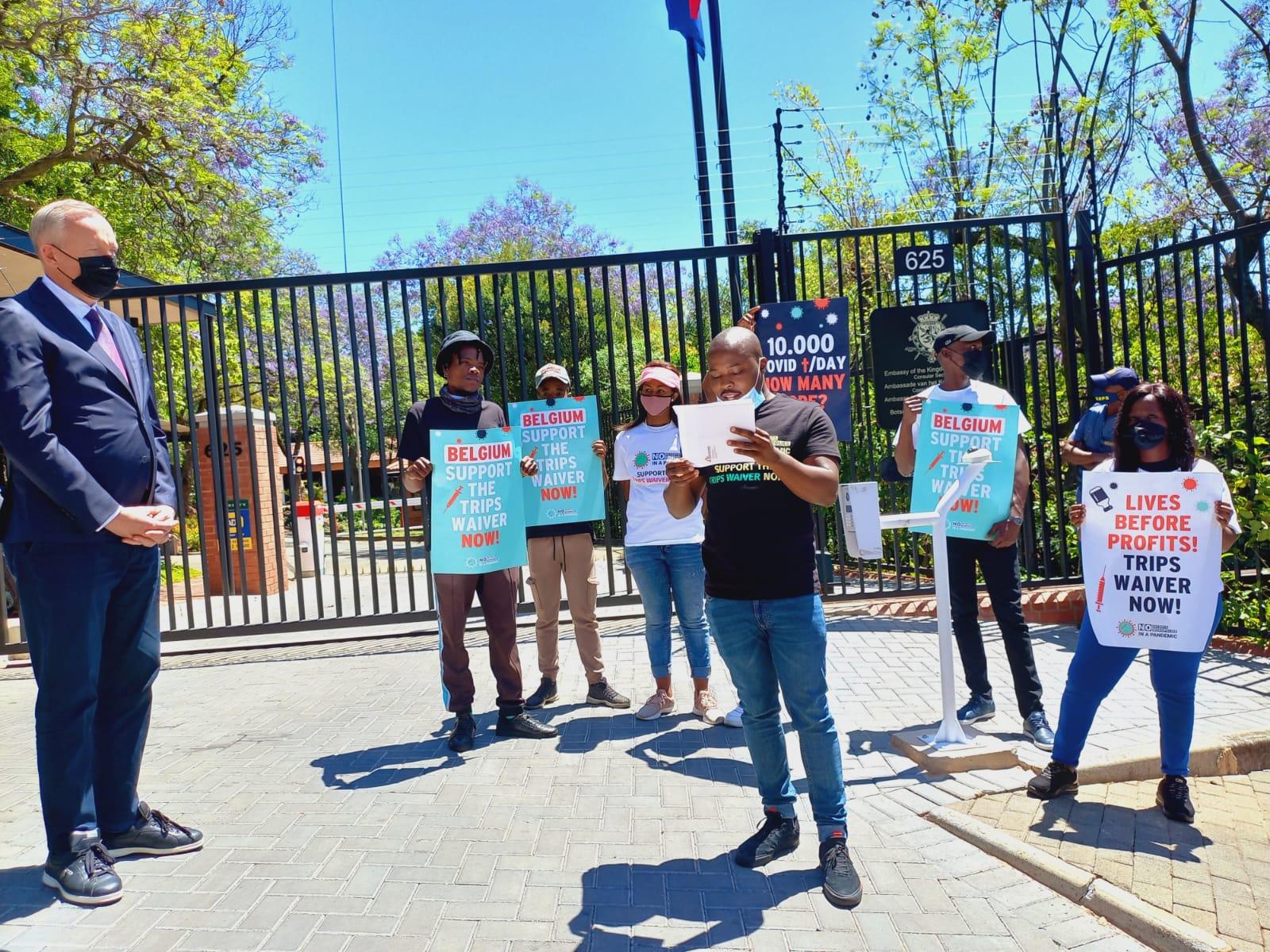 MSF Vusani Raduvha Philanthropy Research Intern in Fundraising reading out the letter to the Belgium Ambassador-Didier Vanderhasselt outside the Belgium Embassy in Pretoria.
