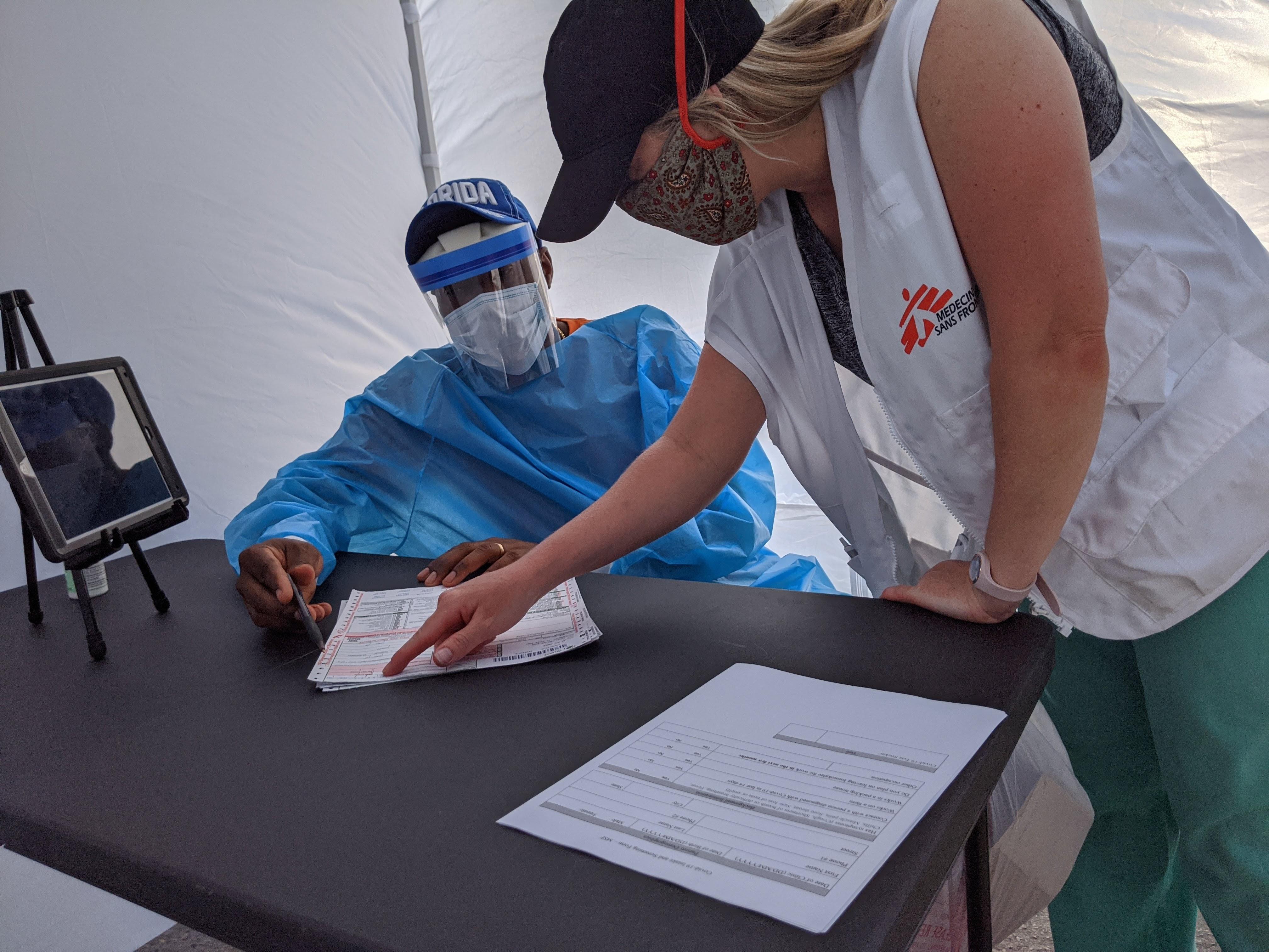 Doctors Without Borders(MSF) team members set up one of the private medical consultation kiosks at a mobile testing and health clinic in Immokalee, Florida, designed to address some of the unmet health needs of the large community of migrant farmworkers in the area during the COVID-19 outbreak.