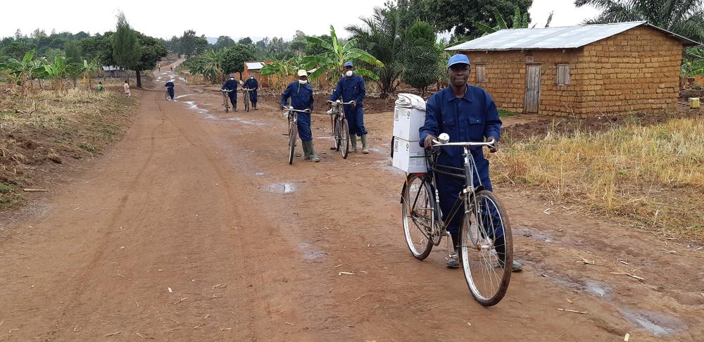 A team is arriving in a village to treat houses against mosquitoes during the 2019 indoor residual spraying campaign in Kinyinya health district.