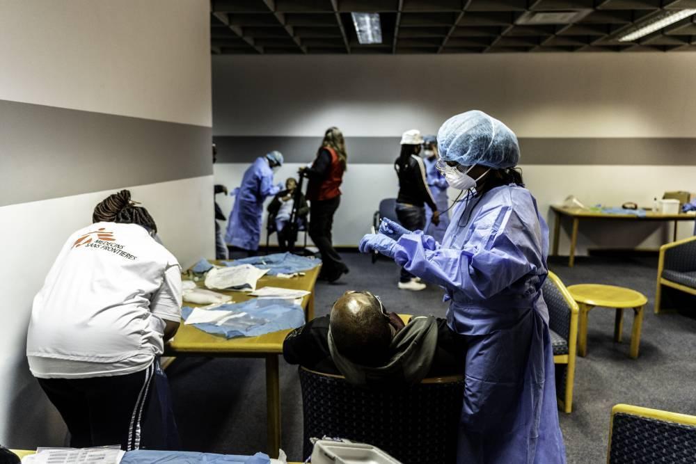 A health worker prepares to swab a patient during a mass COVID-19 screening and testing event held in Johannesburg, South Africa where MSF contact tracers assisted with training, monitoring and conducting tests