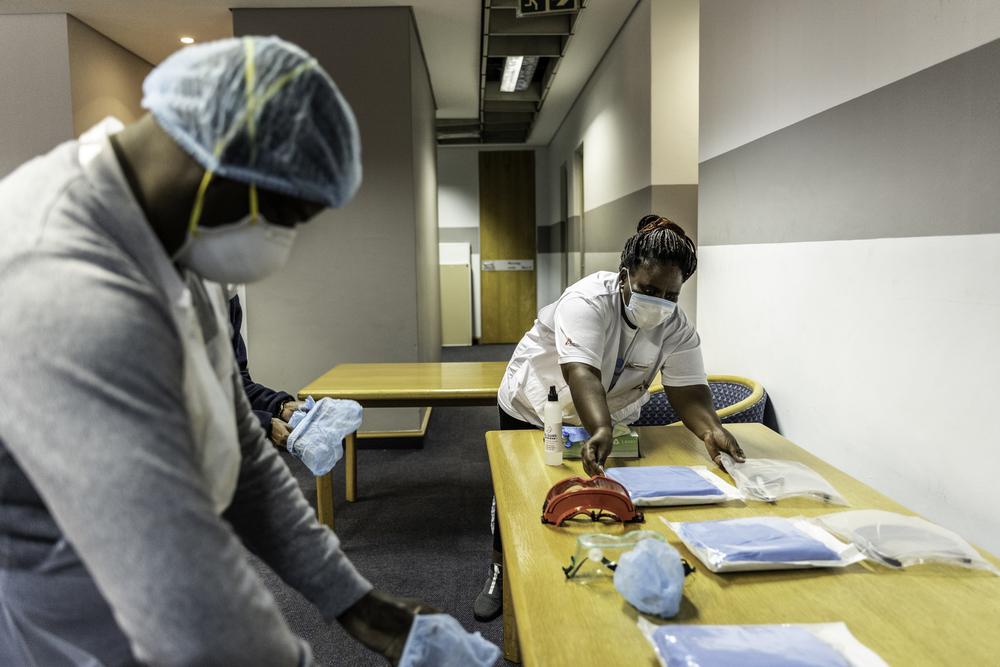 A picture of health workers preparing health promotion items in South Africa