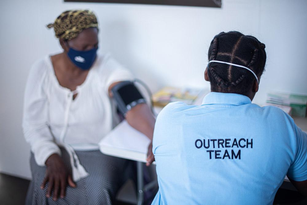 A picture of a patient who is getting their blood pressure checked.