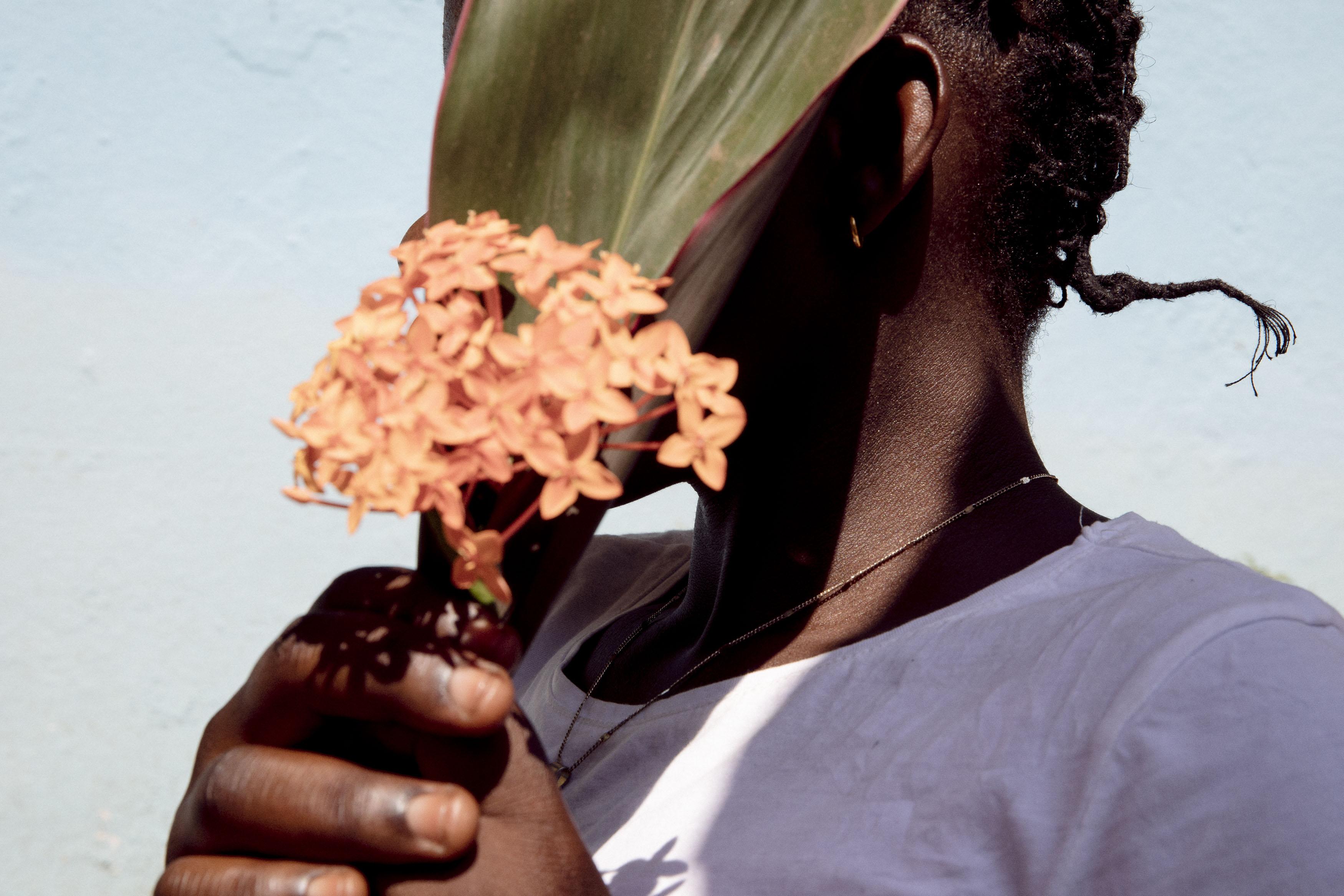Charlotte, 18-years-old, (name changed for protection) poses for a portrait in the garden of the Tongolo centre on 30th November 2020.