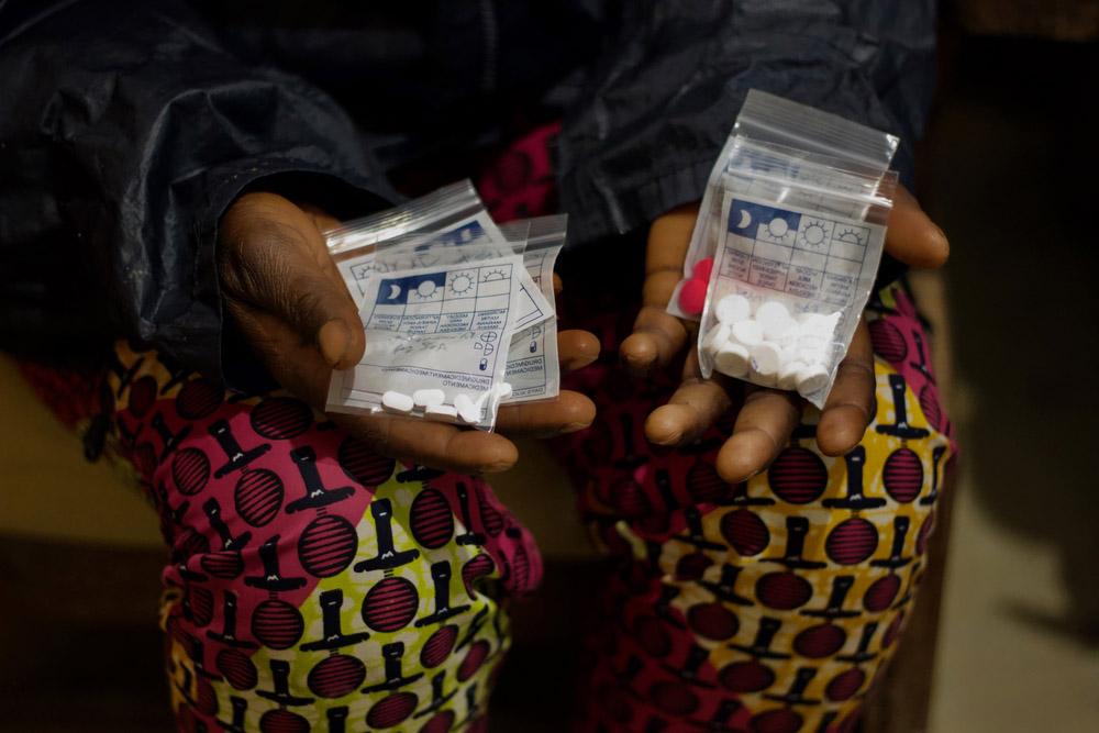 A patient holds the drugs she has just been given to proceed with a termination of pregnancy at Kusisa hospital, North Kivu.