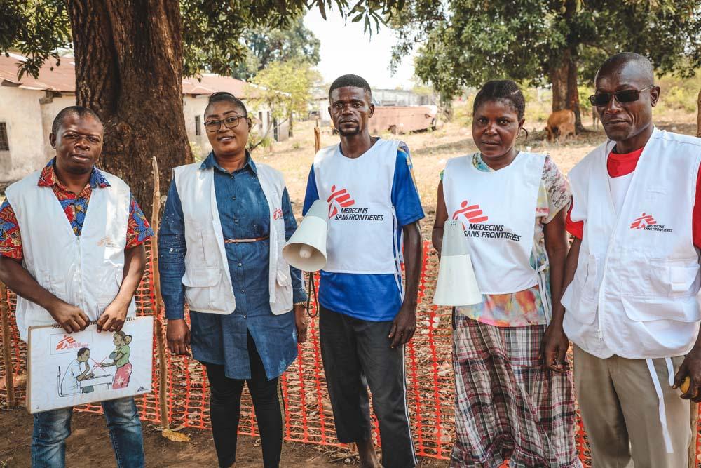 MSF ,Doctors without Borders, health promoters pose with community 