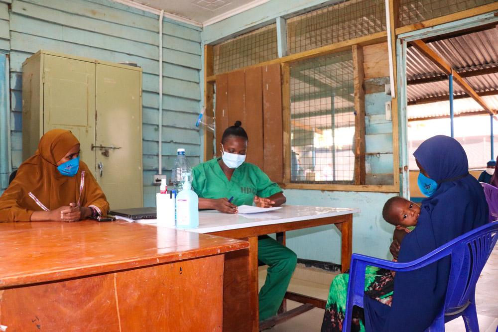 Health workers giving a consultation
